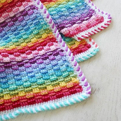 Deken met een mandje vol regenbogen