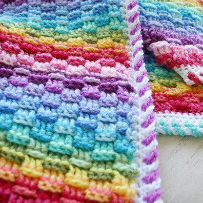 Deken met een mandje vol regenbogen