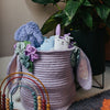 Crocheted toy basket with bunny ears and flowers